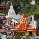 A lively aerial view of Kainchi Dham temple complex capturing its vibrant architecture and bustling activity.